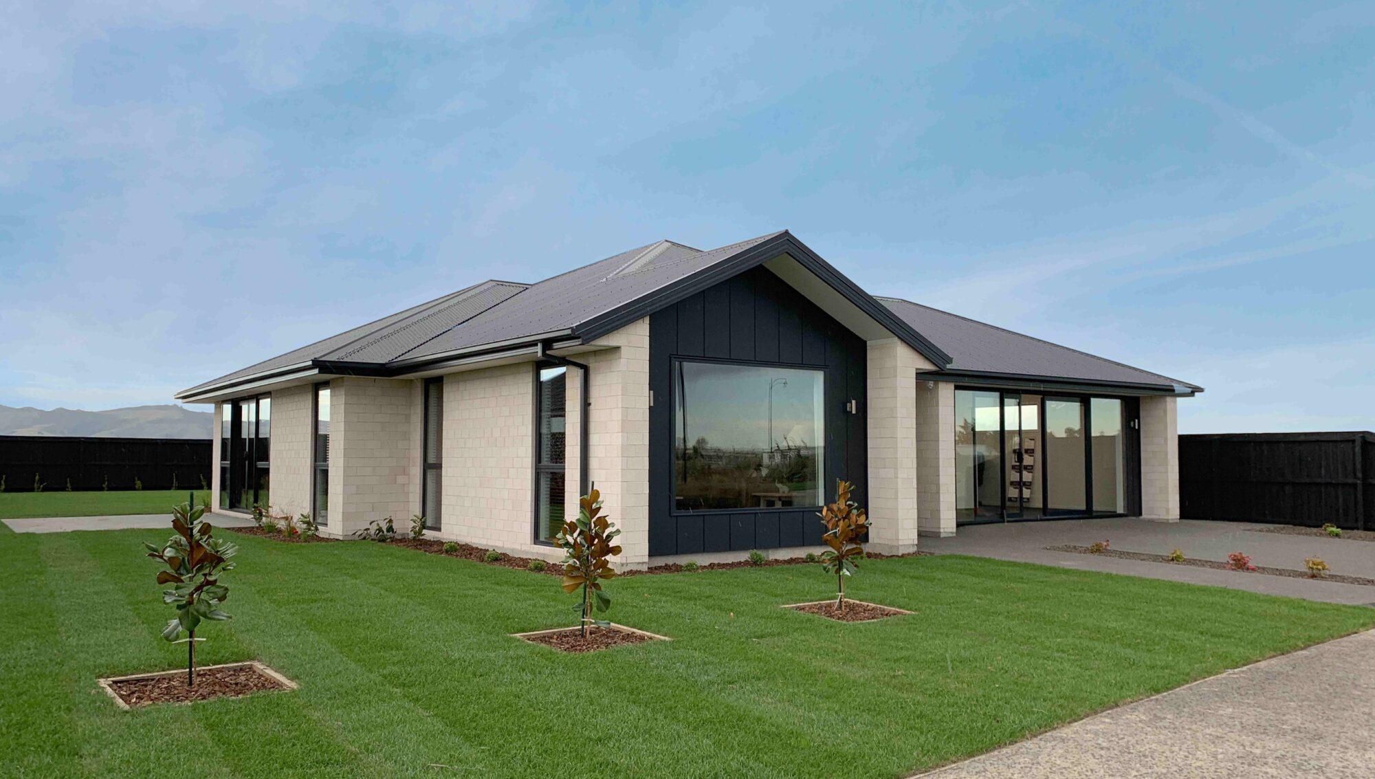 A picture of the Original Te Whāriki Show Home plan - a beautiful and spacious NZ house plan with a 216 m2 floor area, 3 Bedrooms, and 2 Bathrooms.